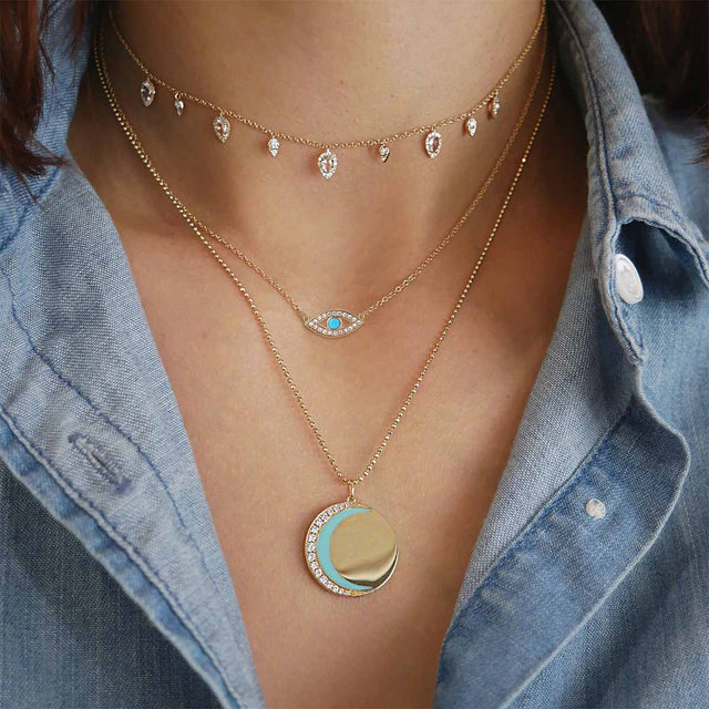 Boho Eye gold pendant necklace by Fettero® styled on a woman, versatile everyday jewelry and thoughtful gift choice