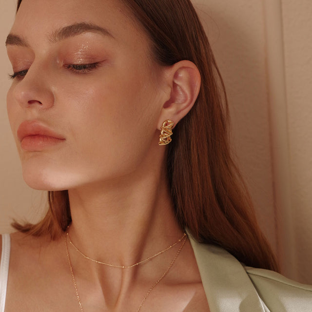 Fettero® chunky twisted studs styled on a woman, versatile gold earrings ideal for daily wear and gifting