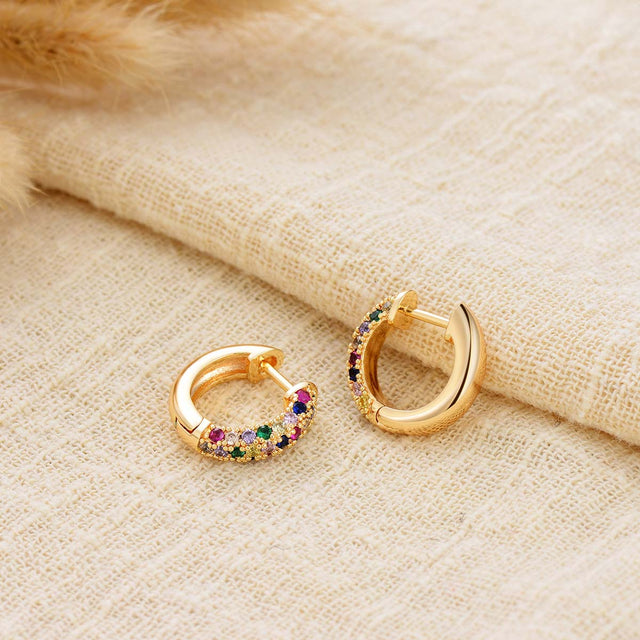 Close-up detail of Fettero® classic color hoop earrings featuring sparkling cubic zirconia and polished gold finish