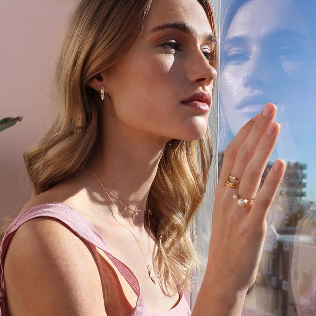 Fettero® dainty spike hoop earrings styled on model, gold earrings for women perfect for everyday wear and gifting