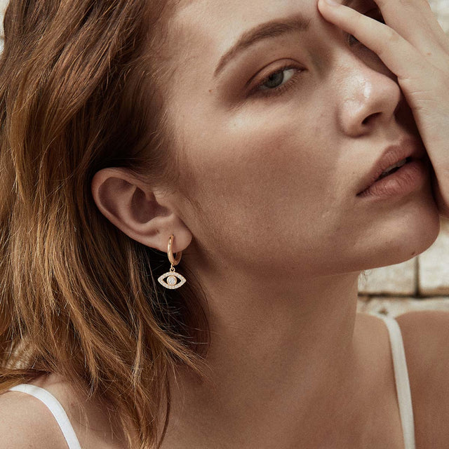 Fettero® evil eye dangle earrings styled on model, gold earrings for women perfect for daily outfits and gifting