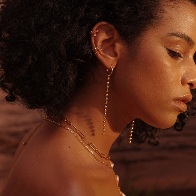 Fettero® heart eye dangle earrings styled on a woman, versatile gold earrings suitable for daily wear and gifting