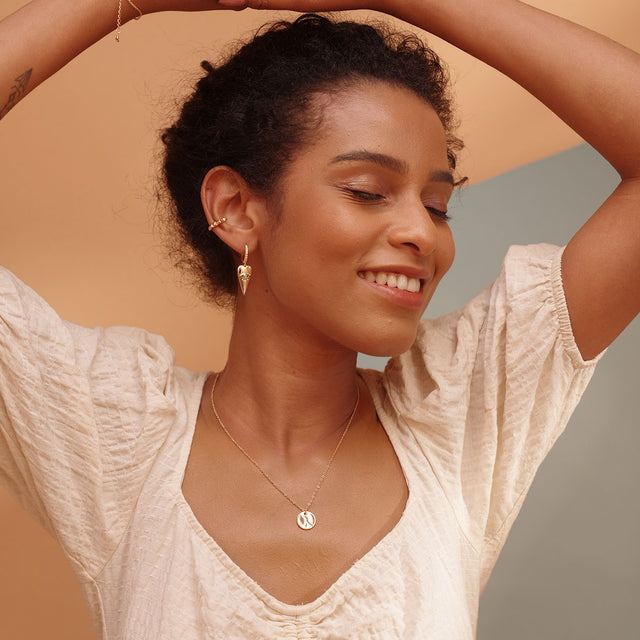 Fettero® heart eye dangle earrings styled on a woman, versatile gold earrings suitable for daily wear and gifting