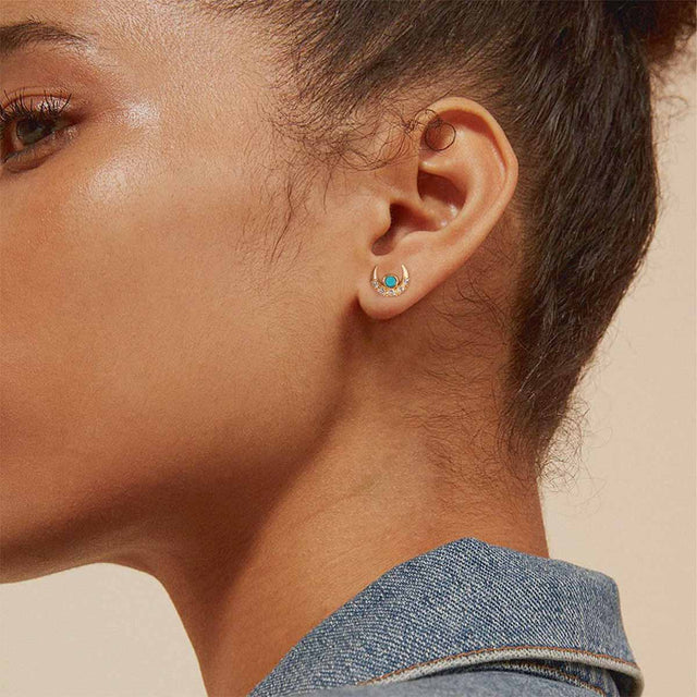Model wearing Fettero® moon turquoise gold stud earrings for women, elegant everyday wear jewelry with celestial design