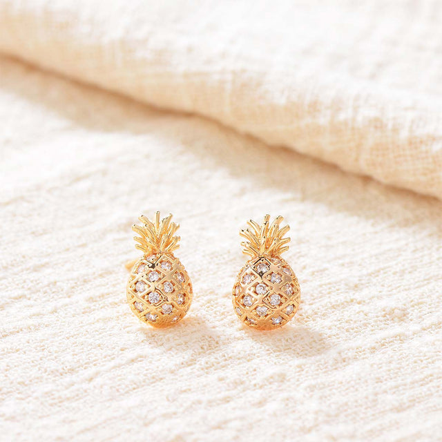 Close-up detail of Fettero® pineapple stud earrings, polished gold finish and delicate craftsmanship for women