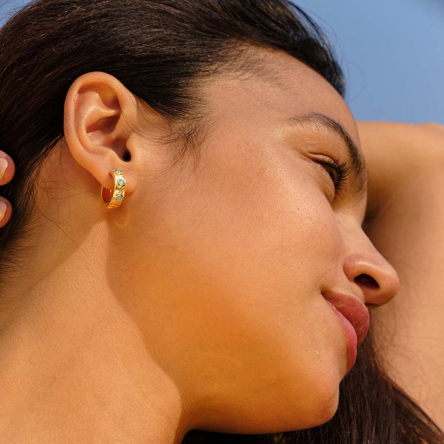 Model wearing Fettero® turquoise inlaid gold hoop earrings for women, elegant everyday wear jewelry with vibrant turquoise accents