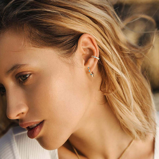 Model wearing Fettero® turquoise spike hoop earrings, gold hoop earrings for women designed for everyday wear