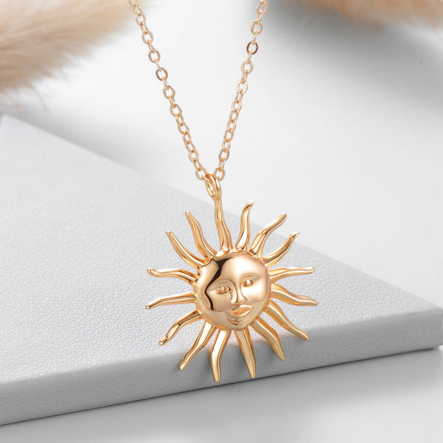 Close-up detail of Evil Sun gold pendant necklace by FETTERO®, highlighting fine craftsmanship and sun-inspired motif
