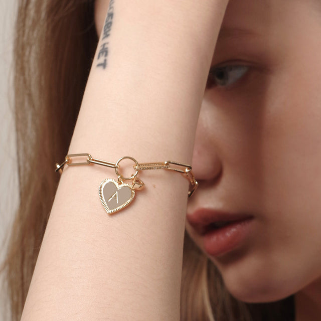 Fettero® initial heart bracelet styled on model, gold bracelet for women ideal for daily wear