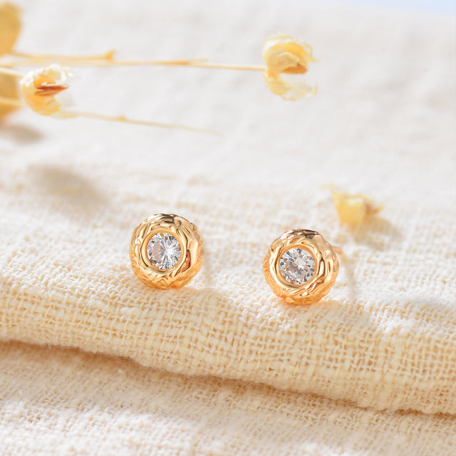 Fettero® mini donut stud earrings styled on a woman, subtle gold jewelry perfect for daily wear or